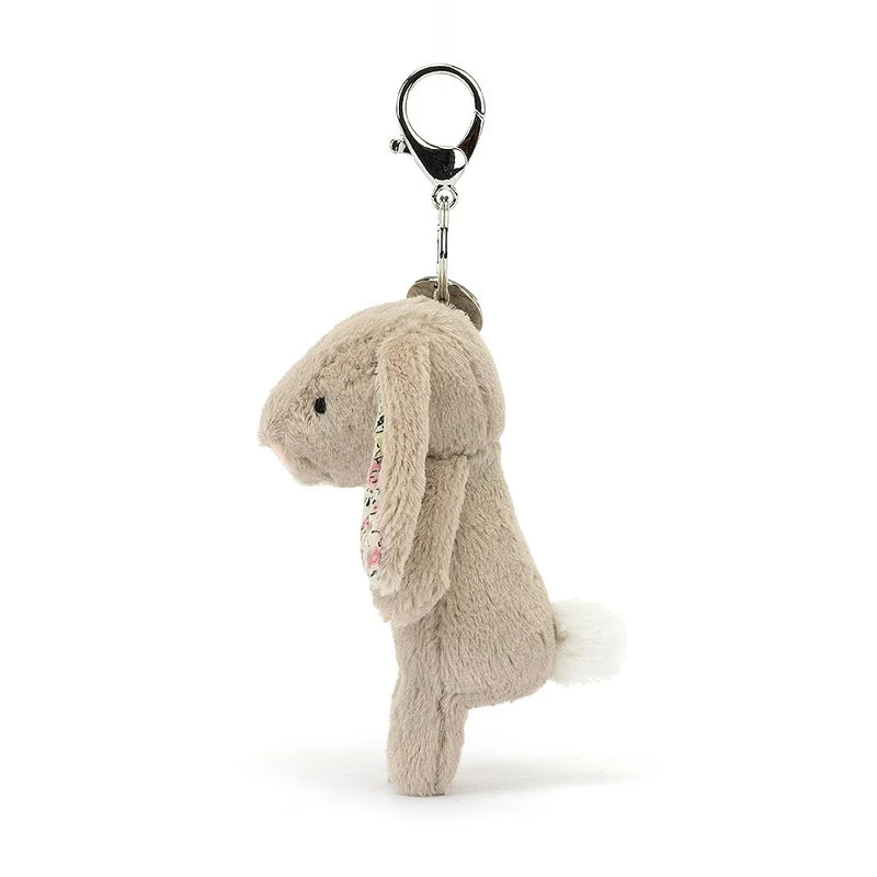 Jellycat - Bijou de sac en forme de lapin beige en fleurs 